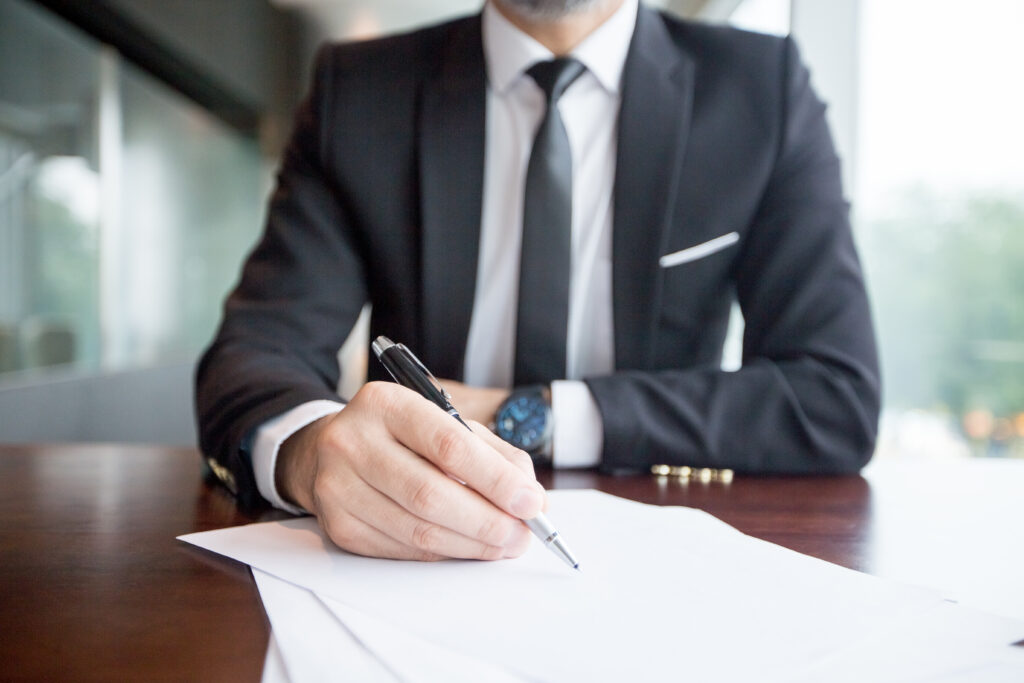 A man preparing Texas LLC documents for LLC creation and compliance.