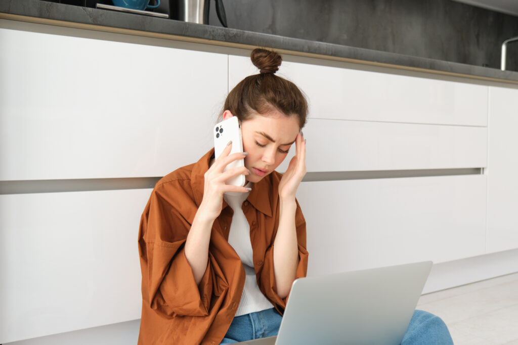 A woman distressing over scam call claiming a legal complaint was filed.