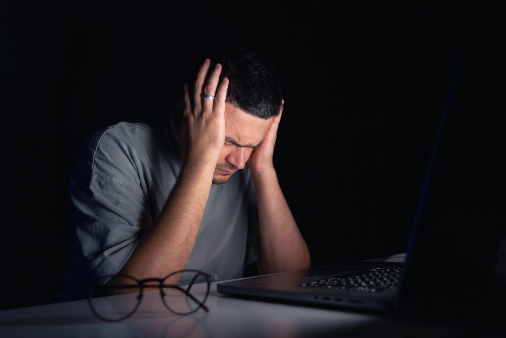 A man agonizing about legal scams.