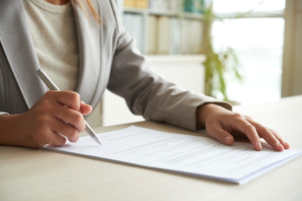 An entrepreneur filling out Arkansas LLC documents.