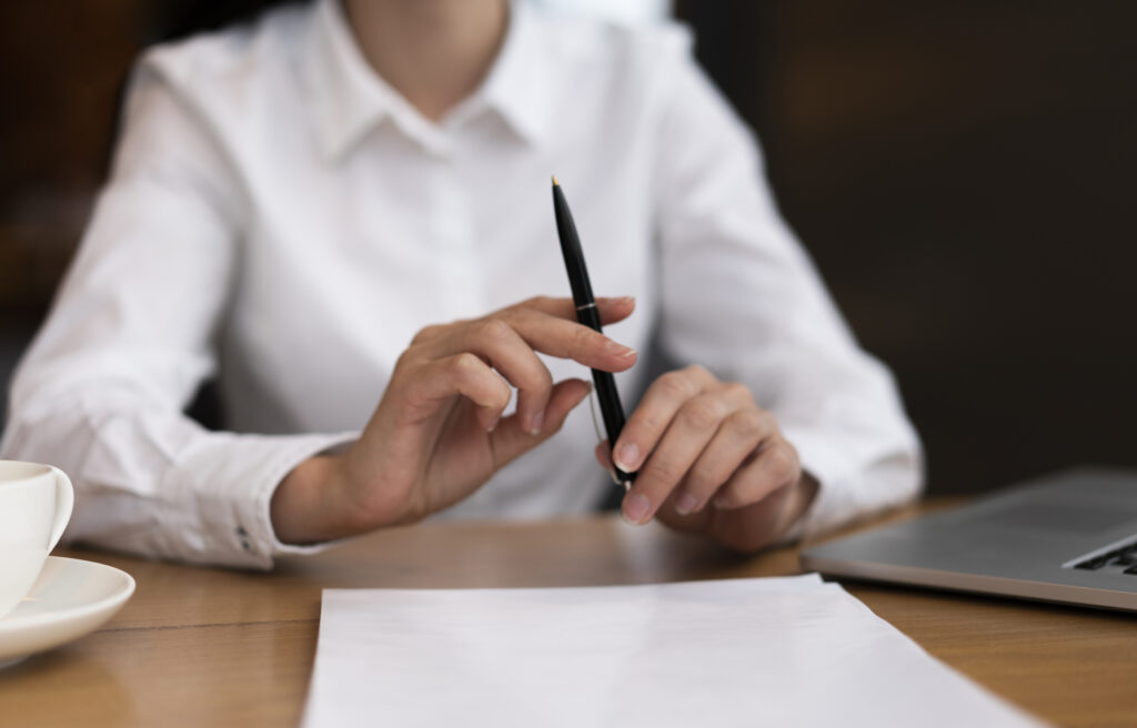 Business person filling out Kansas LLC documents.