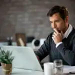 A new agent working at his desk.