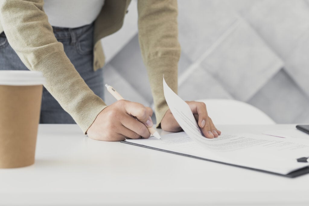 A person preparing Utah LLC documents.
