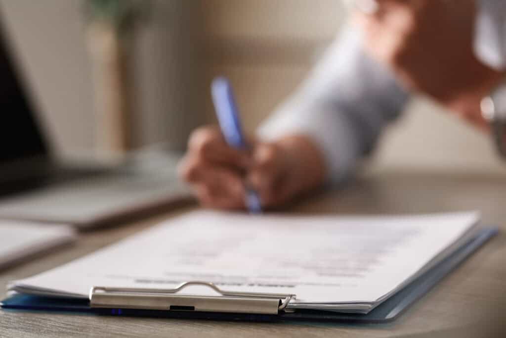 Entrepreneur filling out Nevada LLC documents.