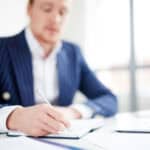 Entrepreneur thinking about business confidentiality.