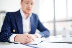 Entrepreneur thinking about business confidentiality.